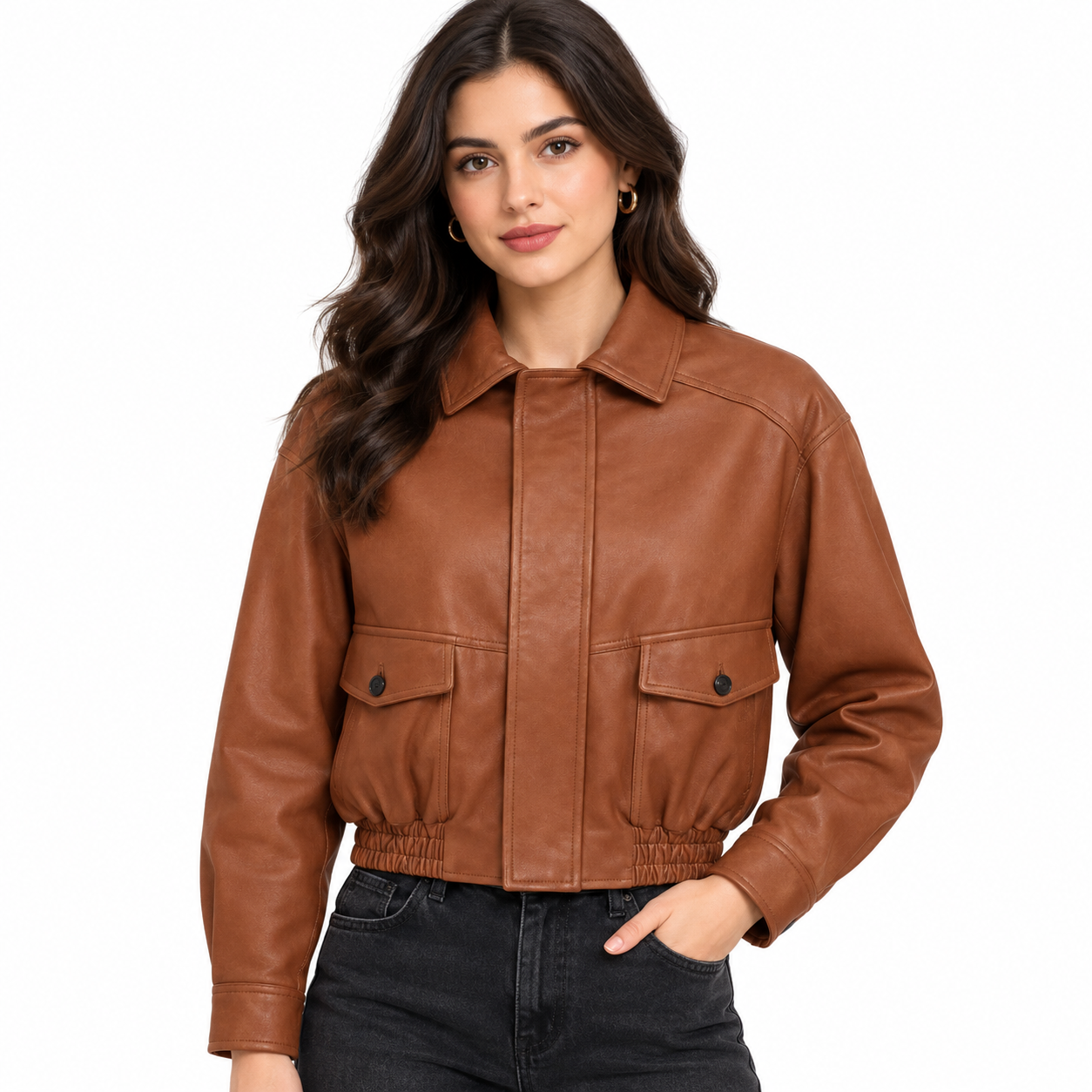 Tan Elan Bespoke Leather Jacket worn by a women’s model, featuring a classic collar, front pockets, cropped fit, and elasticated hem on a white background.