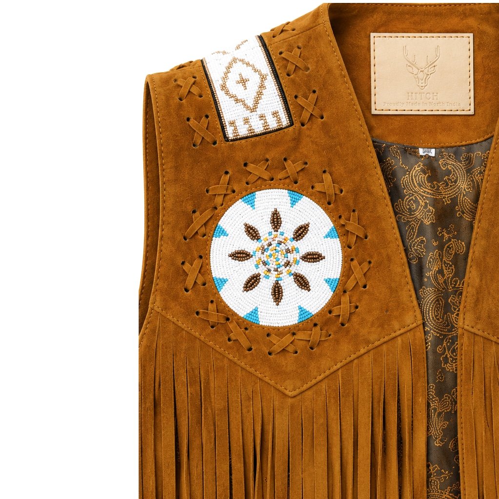 Close-up of handcrafted beaded shoulder panel and lace detailing on Legacy suede leather vest.
